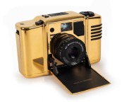 MINOX: 1992 Minox 35mm M.D.C. Gold Special-Edition compact camera [#7800555] with 24-carat gold-plated aluminium body, presented in original timber presentation case, together with maker's box, instruction booklet, and inspection certificate. One of only