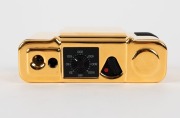 MINOX: 1992 Minox 35mm M.D.C. Gold Special-Edition compact camera [#7800555] with 24-carat gold-plated aluminium body, presented in original timber presentation case, together with maker's box, instruction booklet, and inspection certificate. One of only - 5