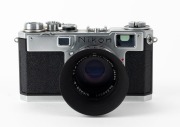 NIPPON KOGAKU: Circa 1956 Nikon S2 rangefinder camera [#6191136], with chrome-body and&nbsp;black dials,&nbsp;Nikkor-S&middot;C&nbsp;50mm f1.4 lens [#389561], and snap-on Nippon Kogaku&nbsp;lens hood. - 2