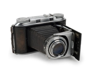 VOIGTLÄNDER: 1951 Bessa II vertical-folding camera, bold-inscription variant with accessory shoe, with Color-Skopar 105mm f3.5 lens [#3566350] and Synchro-Compur shutter. The Bessa II constituted the final and arguably best iteration of the iconic Bessa c