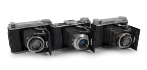 VOIGTLÄNDER: Three 1938 Bessa 66 'Baby Bessa' vertical-folding cameras - one with Heliar 75mm f3.5 lens [#A168749] and Compur shutter, one with Voigtar 75mm f3.5 lens [#A174951] and Compur shutter, and one with Vaskar 75mm f4.5 lens [#3018681], Prontor-S 