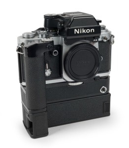 NIPPON KOGAKU: Nikon F2AS Photomic SLR camera [#F2 8037551], circa 1977, fitted with Nikon MD-3 motor drive and MB-2 battery pack.