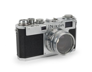 NIPPON KOGAKU: Nikon S2 rangefinder camera [#6154381], circa 1954, with Nikkor-S·C 50mm f1.4 lens [#359483] and lens filter.