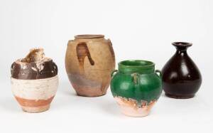Four Chinese stoneware jars, one encrusted with coral, Ming and later, tallest jars 18cm and 13cm high
