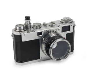 NIPPON KOGAKU: Nikon S2 rangefinder camera [#6169776], circa 1955, with Nikkor-S·C 50mm f1.4 lens [#377125], lens filter and Nikon AR-1 soft shutter release.