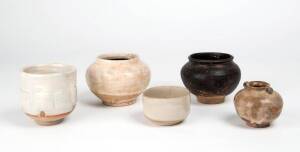 A Cizhou lobbed jar, a black glazed jar, a lugged jar and two bowls, Yuan Dynasty and later. Cizhou jar 8.6cm high, others 8.9cm high and smaller
