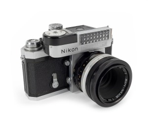 NIPPON KOGAKU: Early production 1960 Nikon F SLR camera [#6414686], with Micro-Nikkor 55mm f3.5 lens [#173210], rear lens cap, and waist-level viewfinder attachment.