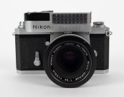 NIPPON KOGAKU: Early production 1960 Nikon F&nbsp;SLR camera [#6414686], with Micro-Nikkor&nbsp;55mm f3.5 lens [#173210], rear lens cap, and waist-level viewfinder attachment. - 2