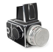 HASSELBLAD: Hasselblad 500C medium-format SLR camera [#TS 41148 & #CR 202739] in black and chrome, circa 1959, with Planar 80mm f2.8 lens [#1595573] and Synchro-Compur shutter, together with metal front lens cap and strap.