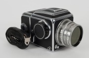 HASSELBLAD: Hasselblad 1600F medium-format SLR camera [#CH 12702 & #CH 14224] in black and chrome, circa 1952, with Ektar 80mm f2.8 lens [#RY263], Hasselblad-Y 1.5-50 lens filter, and carry strap. - 2