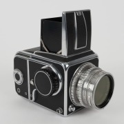 HASSELBLAD: Hasselblad 1600F medium-format SLR camera [#CH 12702 & #CH 14224] in black and chrome, circa 1952, with Ektar 80mm f2.8 lens [#RY263], Hasselblad-Y 1.5-50 lens filter, and carry strap. - 3