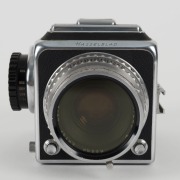 HASSELBLAD: Hasselblad 1600F medium-format SLR camera [#CH 12702 & #CH 14224] in black and chrome, circa 1952, with Ektar 80mm f2.8 lens [#RY263], Hasselblad-Y 1.5-50 lens filter, and carry strap. - 4