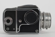 HASSELBLAD: Hasselblad 1600F medium-format SLR camera [#CH 12702 & #CH 14224] in black and chrome, circa 1952, with Ektar 80mm f2.8 lens [#RY263], Hasselblad-Y 1.5-50 lens filter, and carry strap. - 5