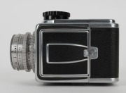 HASSELBLAD: Hasselblad 1600F medium-format SLR camera [#CH 12702 & #CH 14224] in black and chrome, circa 1952, with Ektar 80mm f2.8 lens [#RY263], Hasselblad-Y 1.5-50 lens filter, and carry strap. - 8