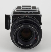 HASSELBLAD: Hasselblad 2000FC medium-format SLR camera [#RV 1514233 & #RP 3240019] in black and chrome, circa 1980, with Planar 80mm f2.8 lens [#5871879]. - 3