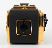 HASSELBLAD: 1985 Hasselblad 2000FC/M '100 Years in Photography' limited-edition medium-format SLR camera [#RI 1520698 & #RI 3264751] in black and gold, with Planar 80mm f2.8 lens [#5872721]. Bears a plaque indicating that this camera is number 227 of 1500 - 7