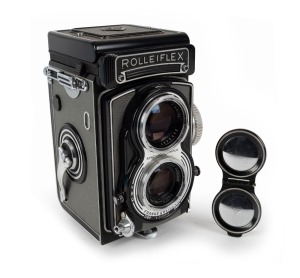 FRANKE & HEIDECKE: Rolleiflex T TLR camera [#T 2120744], circa 1958, with Tessar 75mm f3.5 lens [#1680667] and Synchro-Compur shutter, with metal lens cap.