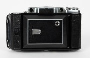 ZEISS IKON: Super Ikonta C 531/2 vertical-folding camera [#R 7283], circa 1950, with Tessar 105mm f3.5 lens [#46045]. - 2