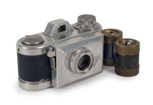 KAMERA WERKSTÄTTEN (MUNICH): Rare Jolly subminiature camera, circa 1950, in blue leatherette, with four original rollfilm spools, of which two are fitted inside the camera body. One of the earliest small cameras to be produced in post-war Germany.