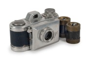 KAMERA WERKST&Auml;TTEN&nbsp;(MUNICH): Rare Jolly subminiature camera, circa 1950, in blue leatherette, with four original rollfilm spools, of which two are fitted inside the&nbsp;camera body. One of the earliest&nbsp;small cameras to be produced in post-war Germany.
