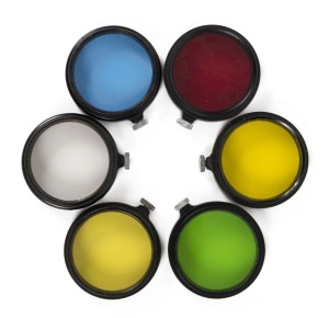 LEITZ: Set of six circa 1931 Leica A36 lens filters - one FIOLOA UVa, one FEOOG dark red, one FIGRO light yellow, one FIGAM medium yellow, one FIPOS green, and one BQCOO blue. (6 items)