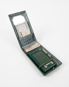 KODAK: Vanity Kodak Ensemble vertical-folding camera [#34553] in green finish, circa 1928, complete with original lipstick, powder compact, mirror, and money pocket in leather case with strap, together with instructions, original owner's card, and maker's - 4