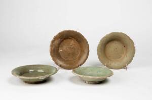 Four Chinese celadon dishes, early Ming Dynasty, 15th century, largest13.8cm diameter