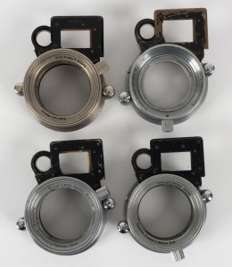 LEITZ: Four Leica near-focusing devices, including examples with SOOKY, NOOKY, and NOOKY-HESUM designations. (4 items)