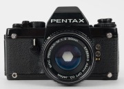 ASAHI KOGAKU: 1980 black-body Pentax LX SLR camera [#5319126], with Pentax-M 50mm f2 lens [#5789943] and metal front lens cap. This model was launched in 1980 to celebrate the company's 60th anniversary. - 2