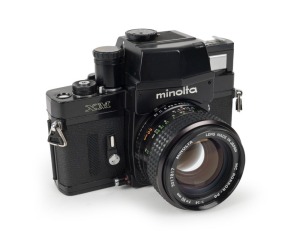 MINOLTA: Black-body Minolta XM SLR camera [#2118631], circa 1973, with MC Rokkor-PG 50mm f1.4 lens [#3017817].