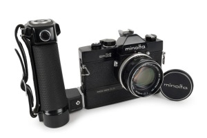 MINOLTA: Black-body Minolta SR-M SLR camera [#1002401], circa 1970, with MC Rokkor-PF 55mm f1.7 lens [#2695730], hand grip attachment, and metal front lens cap. The first 35mm SLR with integrated motor built into the body.