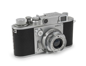 MINOLTA: Minolta 35 Model-E Leica-copy rangefinder camera [#15112], circa 1951, with Super Rokkor 45mm f2.8 lens [#17031]. 'Made in Occupied Japan' engraved on camera base.