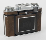 ZEISS IKON: Super Ikonta BX 533/16 horizontal-folding camera [#O 34764], circa 1952, with Opton Tessar 80mm f2.8 lens [#649438] and Synchro-Compur shutter. - 2