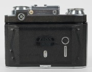 ZEISS IKON: Super Ikonta BX 533/16 horizontal-folding camera [#O 34764], circa 1952, with Opton Tessar 80mm f2.8 lens [#649438] and Synchro-Compur shutter. - 5