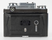 ZEISS IKON: Super Ikonta BX 533/16 horizontal-folding camera [#J 97643], circa 1938, with Tessar 80mm f2.8 lens [#2445184] and Compur-Rapid shutter. - 3