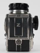 BRONICA: Bronica D SLR camera [#ACB23000], circa 1958, with Zenzanon 100mm f2.8 lens [#1544451], together with metal front lens cap. The first Bronica camera product. - 6