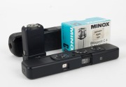 MINOX: Black-body Minox C subminiature camera [#2 467 254], circa 1975, with Minox 15mm f3.5 lens, together with leatherette case, and matching black Minox Cube Flasher attachment in maker's box. - 2