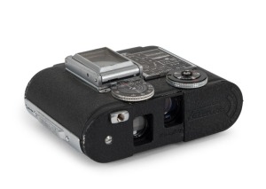 CONCAVA: Black-body Tessina 35 subminiature camera [#769009], circa 1970, with Tessinon 25mm f2.8 lens, together with maker's box.