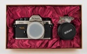 NIPPON KOGAKU: Nikon FM2 Millennium Edition Kit [1292/2000] with champagne-gold FM2 SLR camera and Nikkor 50mm f1.4 lens, both bearing matching serial numbers. Presented in a gold, velvet-lined maker's box together with front and rear lens caps, retail bo - 6