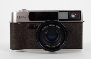 KONICA: 1994 anniversary-edition&nbsp;'Century of Camera Excellence' Hexar Rhodium [#0100003] viewfinder camera, with Hexar&nbsp;35mm f2 lens. Presented in wooden, felt-lined&nbsp;maker's box, together with&nbsp;metal&nbsp;lens cap,&nbsp;HX-14 Auto flash unit [#2039631], leather strap - 3