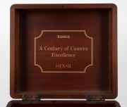 KONICA: 1994 anniversary-edition&nbsp;'Century of Camera Excellence' Hexar Rhodium [#0100003] viewfinder camera, with Hexar&nbsp;35mm f2 lens. Presented in wooden, felt-lined&nbsp;maker's box, together with&nbsp;metal&nbsp;lens cap,&nbsp;HX-14 Auto flash unit [#2039631], leather strap - 7