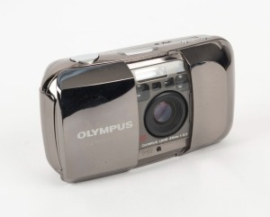 OLYMPUS: 1991 Olympus Mju-I Limited Edition compact camera with mirrored silver body [#0018845] and 35mm f3.5 lens. Presented in lined box with original leather case, instruction booklet, and warranty card.