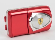 OLYMPUS: 2003 limited-edition red-body Ferrari digital camera [#00206], a cosmetic variant of the Stylus 400, with AF 3x Optical Zoom 17.4mm f5.8 - 5.2mm f3.1 lens. Complete in maker's box with certificate of authenticity, warranty card, instruction bookl - 2