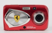 OLYMPUS: 2003 limited-edition red-body Ferrari digital camera [#00206], a cosmetic variant of the Stylus 400, with AF 3x Optical Zoom 17.4mm f5.8 - 5.2mm f3.1 lens. Complete in maker's box with certificate of authenticity, warranty card, instruction bookl - 3