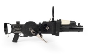 KONICA: Type 89 Moving-Image Machine-Gun Camera Mark II (八九式活動写真銃改二), circa 1933. Complete in custom metal locker with gun sight attachments, six metal film cassettes, lubricant flasks (one still full), servicing tool kit, bracket and clamp. Both camera and locker bear the serial number 2472, and an anchor imprint on the locker indicates that this example was used by the Japanese Imperial Navy.