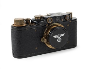 UNKNOWN: Mid-to-late 20th-century black-body Leica II (D) forgery featuring brass fittings and German air force markings, together with black lens cap and leather case.