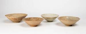 Four Qingbai bowls, each with an incised design, Yuan Dynasty 1280-1368, largest 19.3cm diameter, smallest 26.5cm diameter