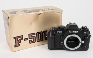 NIPPON KOGAKU: Nikon F-501 AF black camera body [#5130345], circa 1986, in original gold-coloured retail packaging.