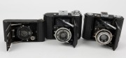 ZEISS IKON: Three vertical folding cameras - one circa 1949 Ikonta 521 [#N 52211 *] with Novar 75mm f6.3 lens, one circa 1929 Ikonette 504/12 with Frontar 80mm f9 lens, and one circa 1937 Nettar 515 [#F 31094] with Novar 75mm f4.5 lens. (3 cameras) - 2