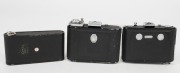 ZEISS IKON: Three vertical folding cameras - one circa 1949 Ikonta 521 [#N 52211 *] with Novar 75mm f6.3 lens, one circa 1929 Ikonette 504/12 with Frontar 80mm f9 lens, and one circa 1937 Nettar 515 [#F 31094] with Novar 75mm f4.5 lens. (3 cameras) - 6